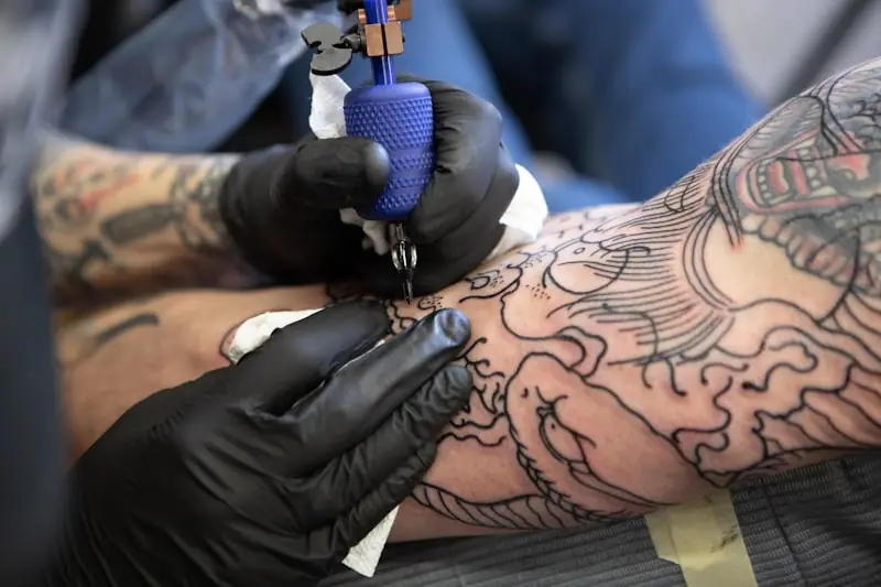 A finished sleeve tattoo on a forearm.