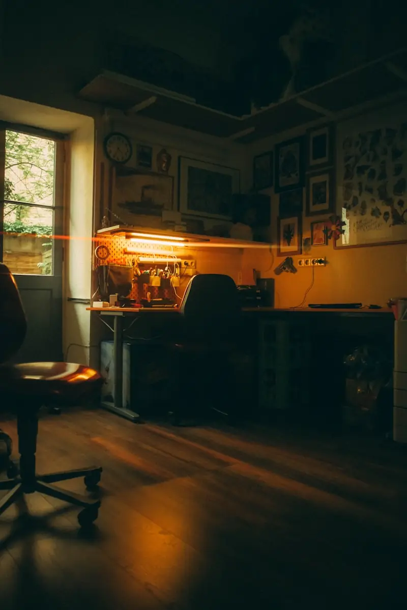 A studio workstation beside a window.