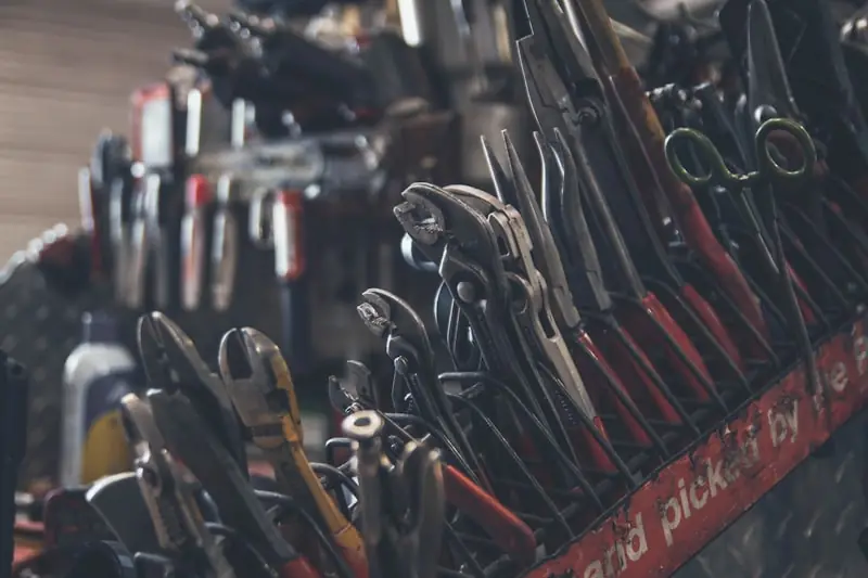 Hand tools laid out on a work surface.